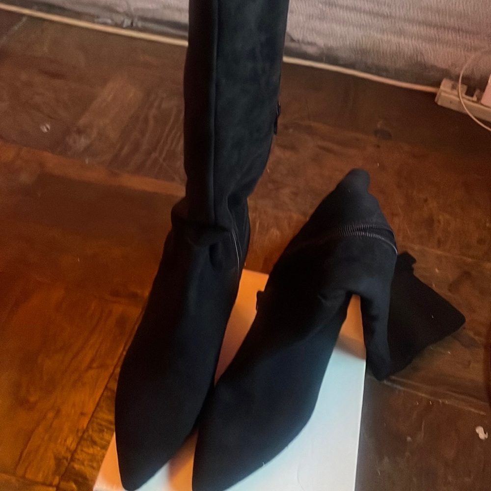 Black knee high boots with heels
